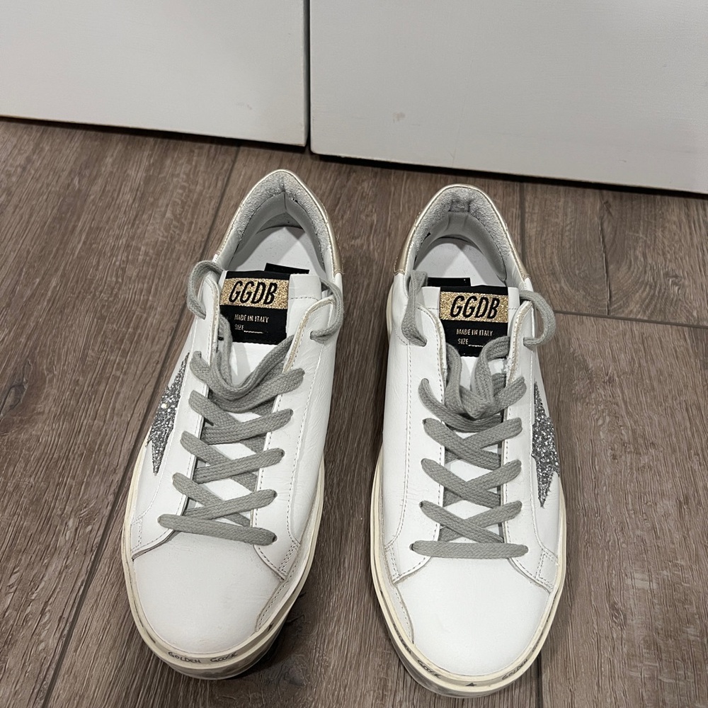 Golden Goose Hi Star Sneakers in white leather. Sliver glitter star w/ gold heel